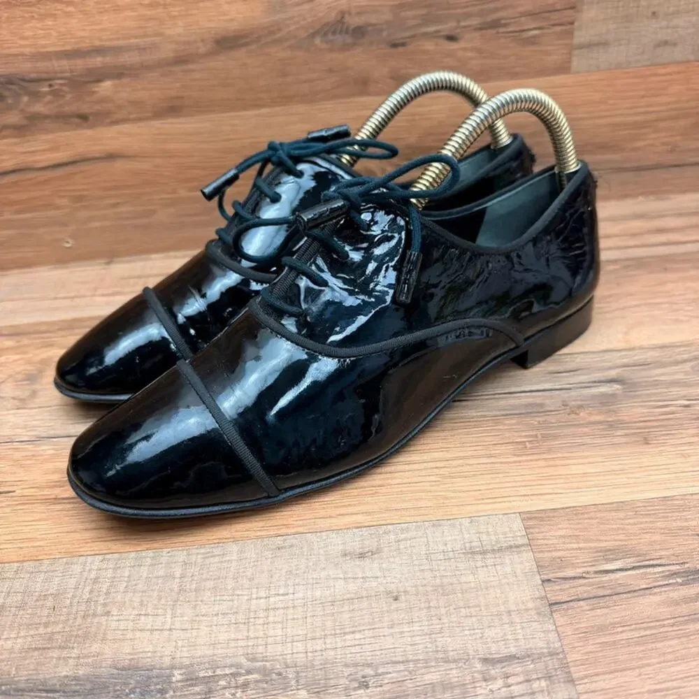 Tory Burch women Size 9M Bombe Royal black Leather Oxford shoes